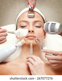 Spa Salon: Young Beautiful Woman Having Different Facial Treatment