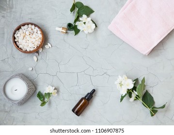 Spa Setting Flatlay With Bath Salt, Jasmine Oil Bottle And Flowers, Towel And Natural Soap. Spa And Wellness Still Life