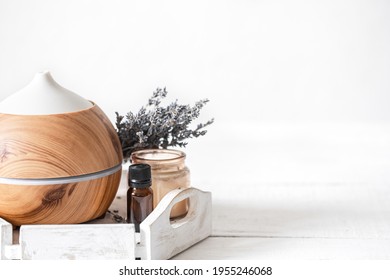 Spa Still Life With Air Humidifier And Natural Lavender Aromatic Oil.