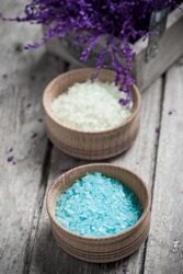 SPA Still Life, Bath Salt Closeup With Violet Flowers On Wooden Background. Desaturated
