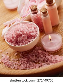 Spa still life with pink sea salt and flower petals on wooden background - Shutterstock ID 271449758