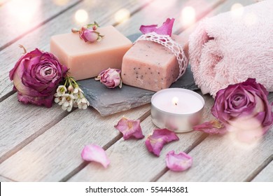 Spa still life with wellness products on a wooden table and bokeh