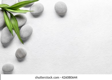 Spa stones with bamboo on paper