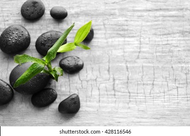 Spa stones and bamboo on wooden background