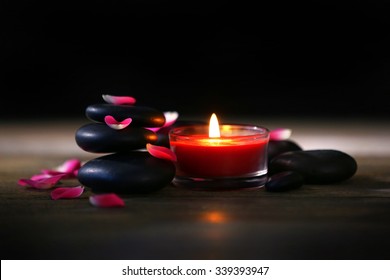 Spa Stones And Candles On Dark Background