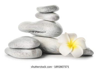 Spa stones and flower on white background
