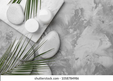 Spa stones and leaves on grey background - Powered by Shutterstock