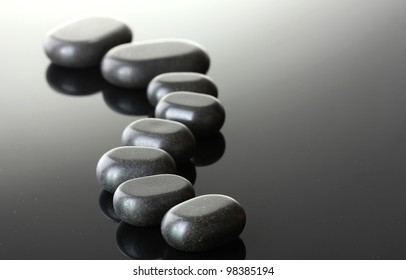Spa stones on grey background