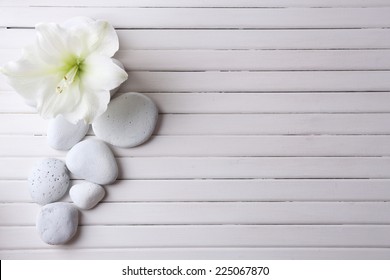 Spa stones on wooden table