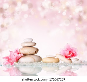Spa Stones And Pink Flower On Pink Background