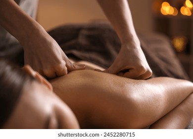 Spa therapy. Beautiful young woman lying on table during massage in salon, closeup - Powered by Shutterstock