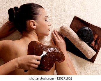 Spa therapy for young woman having cosmetic mask at beauty salon - Powered by Shutterstock