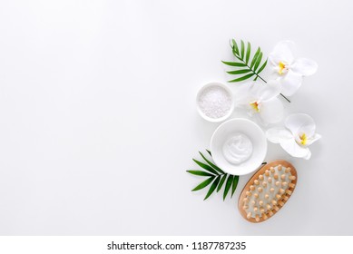 Spa treatment concept, flat lay composition with natural cosmetic products and massage brush, view from above, blank space for a text - Powered by Shutterstock