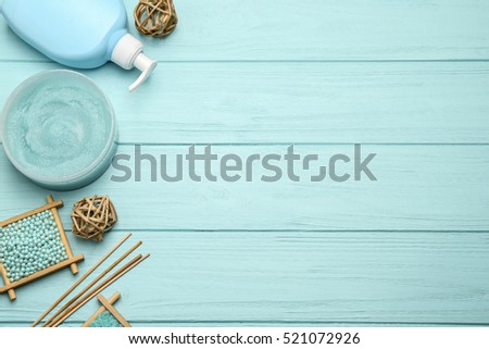 Spa treatments on blue wooden background