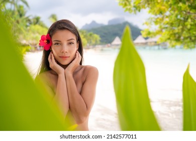 Spa wellness beauty portrait at beach. Serene multicultural woman outdoors at tropical luxury spa resort. Young mixed race Asian Caucasian female model