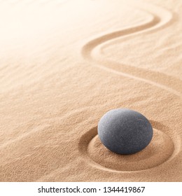 Spa Wellness For Inner Life Therapy And Spiritual Health. Zen Meditation Stone For Relaxation. Concept For Purity Balance And Harmony. Background With Raked Sand.