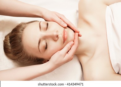 Spa. Woman Enjoying Anti-aging Facial Massage