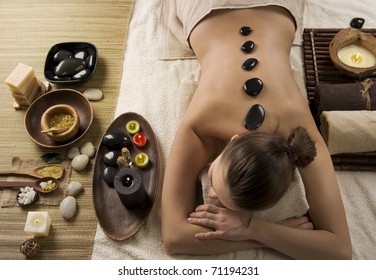 Spa Woman.Hot Stones Massage.Beauty Salon