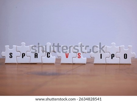 SPAC Vs IPO Concept Represented With Puzzle Pieces On white Background