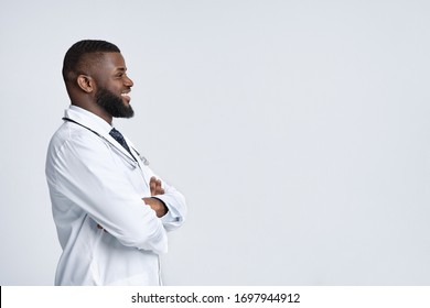 Space For Advertisement. Profile Picture Of African American Doctor Looking At Empty Space, White Background