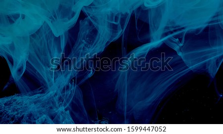 Space blue technological abstract background. Stylish modern technology background. Watercolor ink in water. Cool trending screensaver.