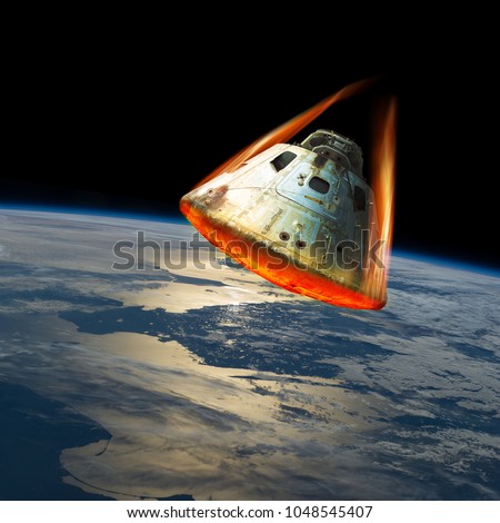 A space capsule reenters the earths atmosphere causing the heat shield to glow from the friction of tremendous speed. Elements of this image courtesy of NASA.