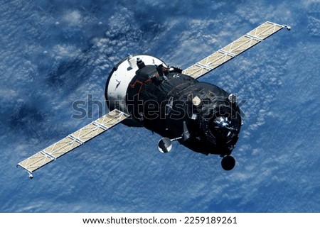 Space cargo ship in flight. Elements of this image furnished by NASA. High quality photo