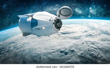 Space craft over the Earth planet. International space station. Stars and galaxies on background. Elements of this image furnished by NASA - Powered by Shutterstock