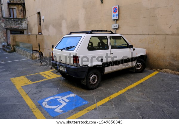 Space Handicapped parking spot in open parking\
in Siena, Italy on Oct. 27,\
2019