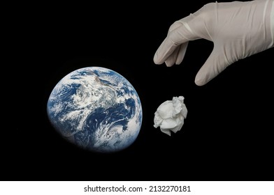 Space Junk Above Earth, And Hands In White Gloves. Space Trash Concept.Space Debris.pollution Of The Atmosphere.Cosmic Garbage.abandoned Artificial Satellite.orbit Dangerous.