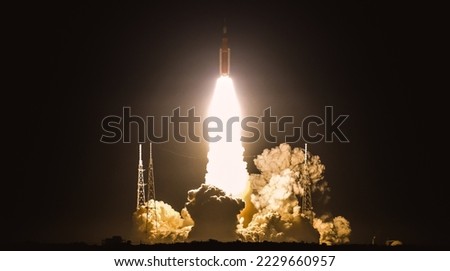 Space Launch of Orion spacecraft rocket blasting into space. Elements of this image furnished by NASA.
