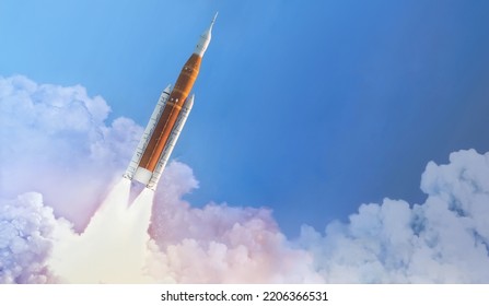Space launch system flight in space from Earth. SLS rocket in sky. Mission on Moon of Orion spacecraft. Spaceship take off. Artemis space program. Elements of this image furnished by NASA - Shutterstock ID 2206366531