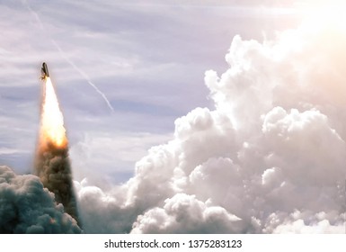 Space Launch System Takes Off into deep space. Launch with dust and smoke. Elements of this image furnished by NASA.