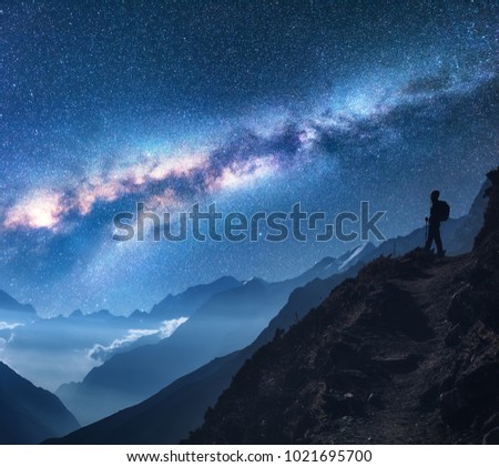 Similar – Image, Stock Photo People hiking at night. Mountains at sunrise. Man standing on peak. Natural mountain landscape with illuminated misty peaks, foggy slopes and valleys