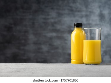 Space Pineapple Juice Or Orange Juice In Bottle And Glass Food Background 