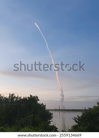 Space rocket launch with engine smoke trail 