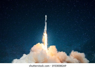 Space rocket launch, ship. Concept of business product on a market. Spaceship takes off in the starry sky. Rocket space ship . Mixed media - Shutterstock ID 1933008269