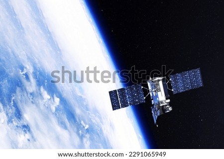 A space satellite above the Earth's surface. Elements of this image furnished NASA. 