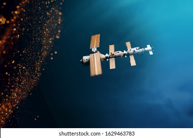 Space Satellite Orbiting The Blue Planet. Decorations For Photo Sattelite. Selected Focus