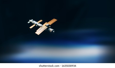 Space Satellite Orbiting The Blue Planet. Decorations For Photo Sattelite. Selected Focus