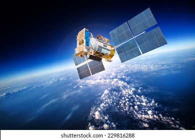 Space satellite orbiting the earth. Elements of this image furnished by NASA - Shutterstock ID 229816288