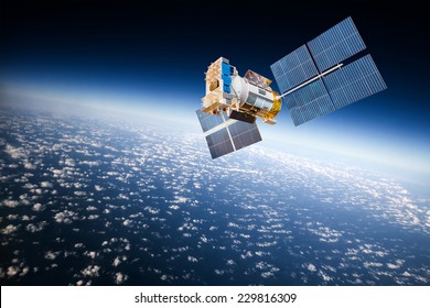 Space satellite orbiting the earth. Elements of this image furnished by NASA - Shutterstock ID 229816309