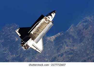 Space shuttle, above the Earth. Elements of this image furnished by NASA. High quality photo