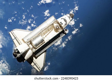 Space shuttle above the surface of the Earth. Elements of this image furnished by NASA. High quality photo