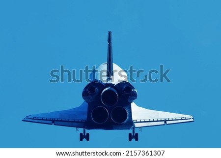 Space shuttle from behind, taking off. Elements of this image furnished by NASA. High quality photo