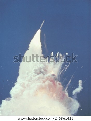 Space shuttle Challenger disaster. 76 seconds into flight, reddish-brown cloud envelops the disintegrating shuttle. Fragments of the shuttle can be seen tumbling against. Jan. 28, 1986.