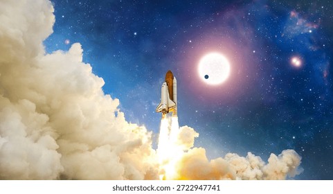 The space shuttle flight from Earth surface into space. The spacecraft in a cloudy night sky. The launch of rocket carrying astronauts into outer space. The anniversary of the space shuttle launch. Landscape of night sky with clouds, stars and spaceship. Elements of this image furnished by NASA