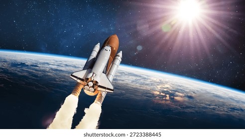 Space shuttle flight from Earth surface into space. The spacecraft in the stars. The launch of rocket carrying astronauts into outer space. Elements of this image furnished by NASA. Not AI.