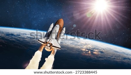 Space shuttle flight from Earth surface into space. The spacecraft in the stars. The launch of rocket carrying astronauts into outer space. Elements of this image furnished by NASA. Not AI.