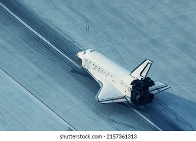 The space shuttle is landing. Elements of this image furnished by NASA. High quality photo - Powered by Shutterstock